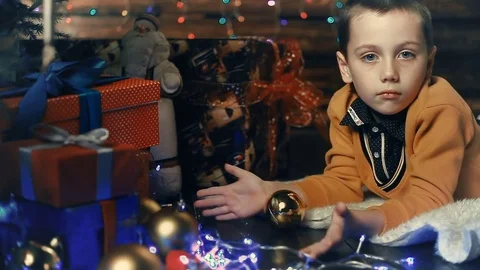 A small boy decorates a Christmas tree Video stock 81160810