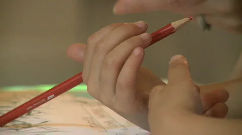 Small boy drawing with a pencil Stock Footage 264897