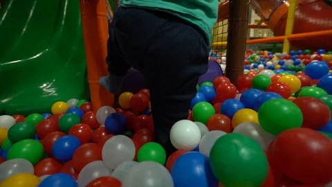 A small  boy dressed in a turquoise t-shirt and blue pants Stock Footage 104028356