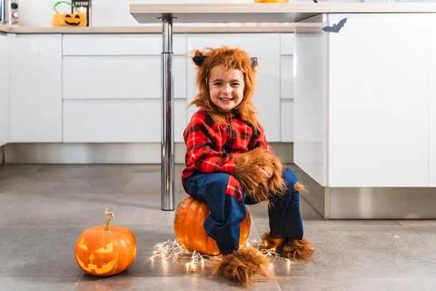 Small boy dressed as werewolf gesturing while scaring the camera during Stock Photos