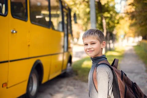 Small boy going home after school after the day of studying Stock Photos