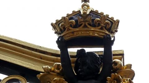 A small boy holding a crown and sitting on gold Video stock 47855193