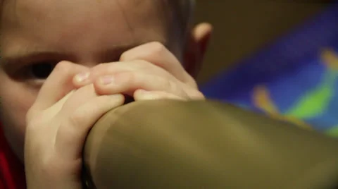 Small boy looks through the telescope and admires the beauty of nature Stock Footage 36174257