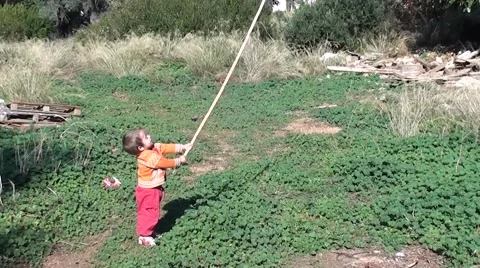 Small boy playing with big stick, Crystal child Stock Footage 59529692