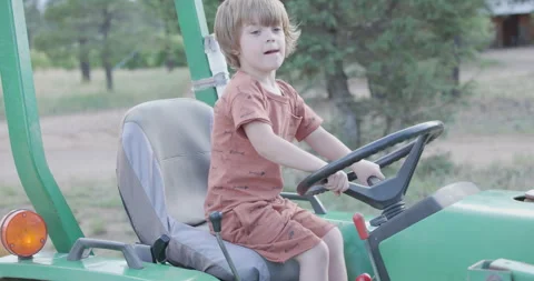 Small Boy Playing on a Tractor Stock Footage 244156188