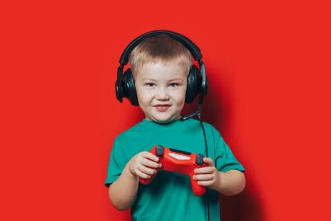 Small boy playing video game Stock Photos