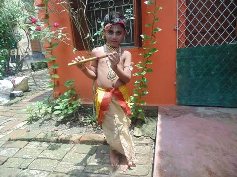 A Small Boy Posing As Little Krishna Stock Photos