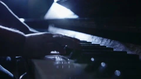 Small boy in Queen Freddy Mercury outfit playing on a piano close up Stock Footage 158720490