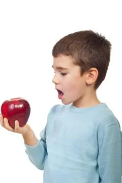 Small boy ready to bite red big apple Stock Photos