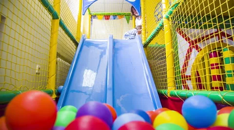 Small  boy Sliding Into Multicolored Balls 스톡 동영상 41496814