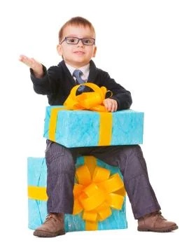 Small boy in spectecles with big present Stock Photos