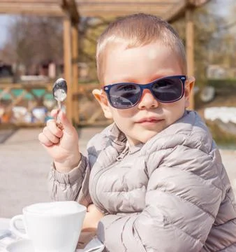 Small boy with spoon in hand Stock Photos