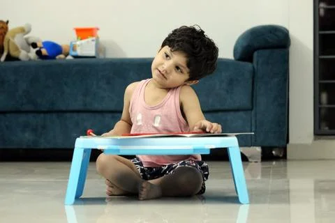 Small boy, toddler while doing Homework interacting with parent, school student, Stock Photos