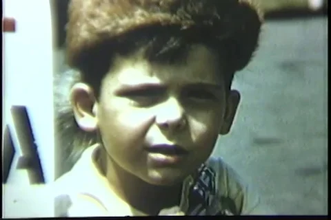 Small boy with toy rifle points it at camera - 1950 Stock Footage 93002783
