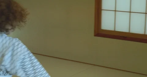 Small boy twists, twirls and dances while wearing traditional yukata 库存影片 107836719