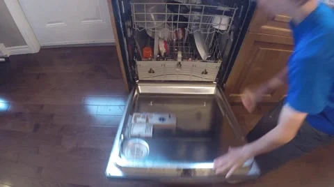 Small boy unloading the dishwasher Video stock 40487025