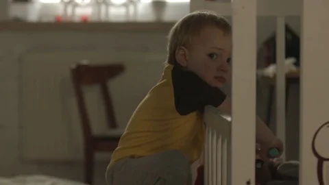 A small, brave boy himself climbs into bed. Video stock 73663756