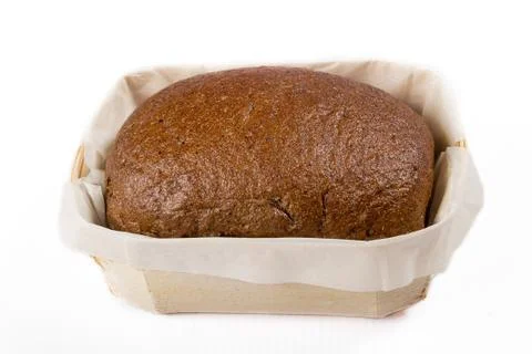 Small bread in a basket on a white background, studio photo Stock Photos