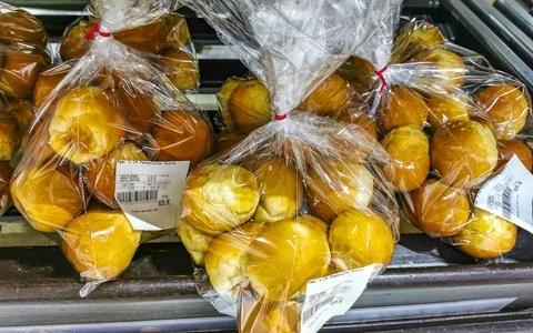 Small bread rolls in plastic bags at the supermarket in Mexico. Stock Photos