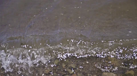 Small breaking waves at shoreline of Lake HD Stock Footage 36982914