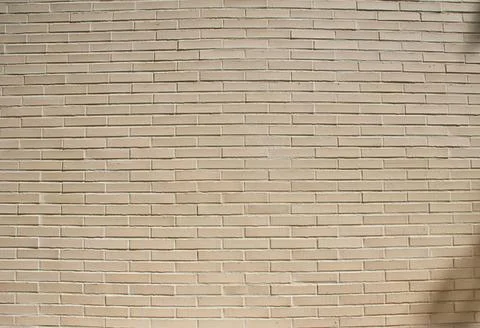 Small brick wall background, brick texture, masonry pattern, construction facade Stock Photos