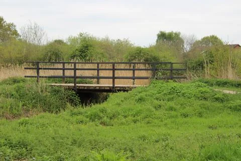 Small bridge crossing a stream Stock Photos