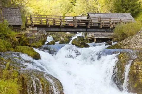 Small bridge on fall with mills on each side Stock Photos