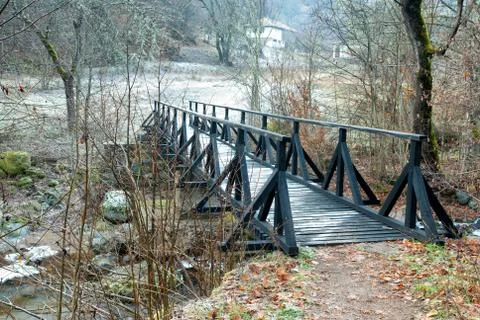 Small bridge on mountain river in the winter Stock Photos
