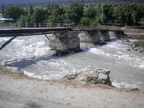 A small Bridge in the mountains over the river in Pahalgam, Kashmir, India Stock Photos