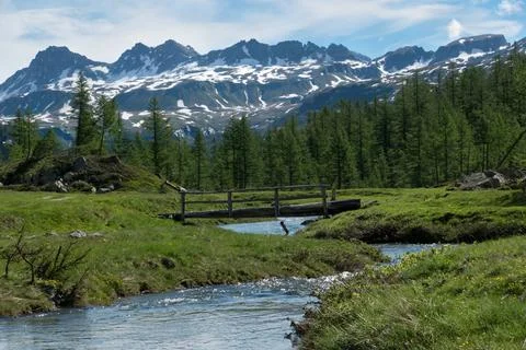 Small bridge over river alpine landscape Stock Photos