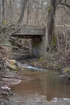 Small bridge over the river in forest Stock Photos
