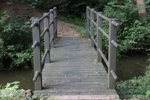 Small bridge over a river Stock Photos