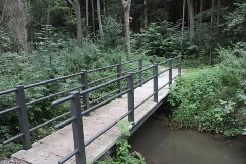 Small bridge over a river Stock Photos