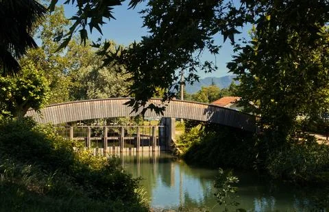 A small bridge over the river. Stock Photos
