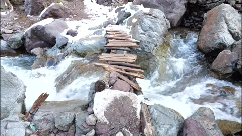 Small bridge on a river on the way to Toubkal Summit. Toubkal National Parc Video stock 328816301