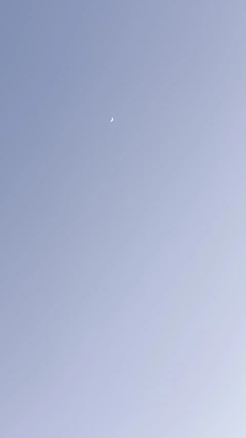Small Bright Moon or Planet in Blue Sky Video stock 344807574