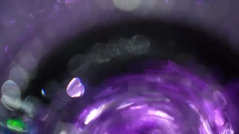 Small, bright, multi-colored semi-circular bokeh light Stock Footage 315319516