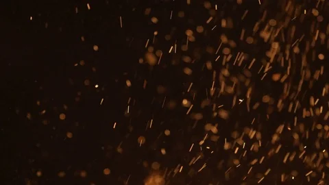 Small bright sparks are flying from bonfire at night Stock Footage 73348885