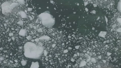 Small Broken Bits of Iceberg in Green Water Aerial Stock Footage 292941698