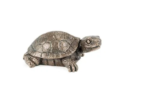 Small bronze statuette of a turtle, head turned to the camera, isolated on wh Stock Photos