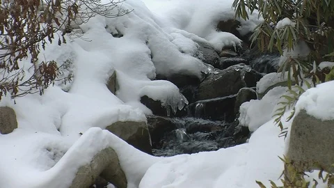 Small brook running over rocks in winter Stock Footage 103164389