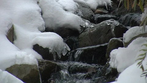 Small brook running over rocks in winter Stock-Footage 103164448