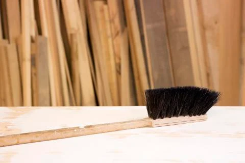 Small broom on table at workshop 스톡 사진