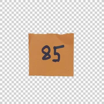 Small brown square paper note with the number eighty five written in black in Фото
