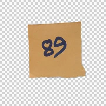 Small brown square paper note with the number eighty nine written in dark b.. Фото