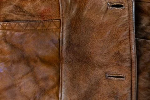 Small brown thick seude jacket closeup texture with selective focus and blur Photos