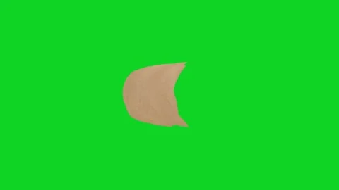Small brown torn paper piece floating free view revealing animated on green Stock Footage 335216505