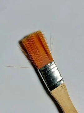 Small brush on paper background. Фото