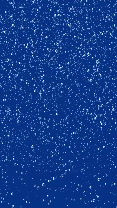 Small bubbles rising in blue liquid Stock Footage 233455206