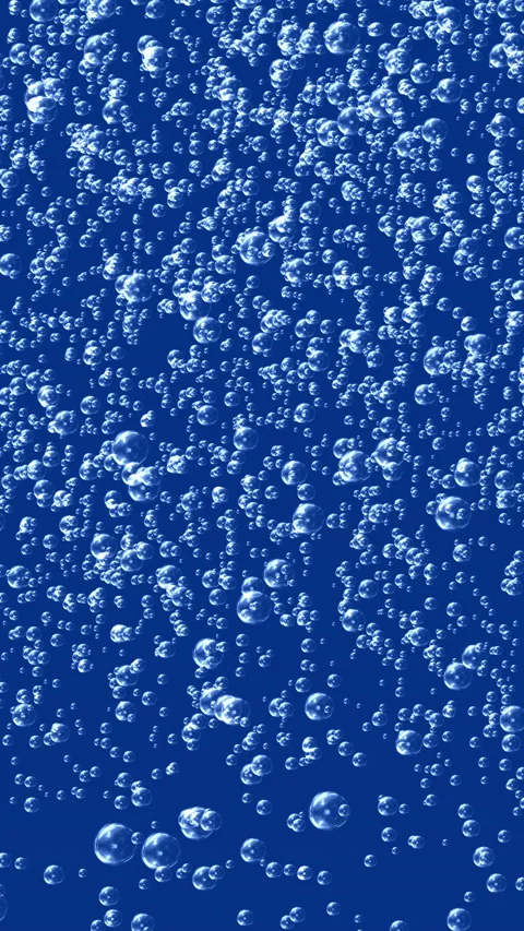 Small bubbles rising in blue liquid Stock Footage 233455868